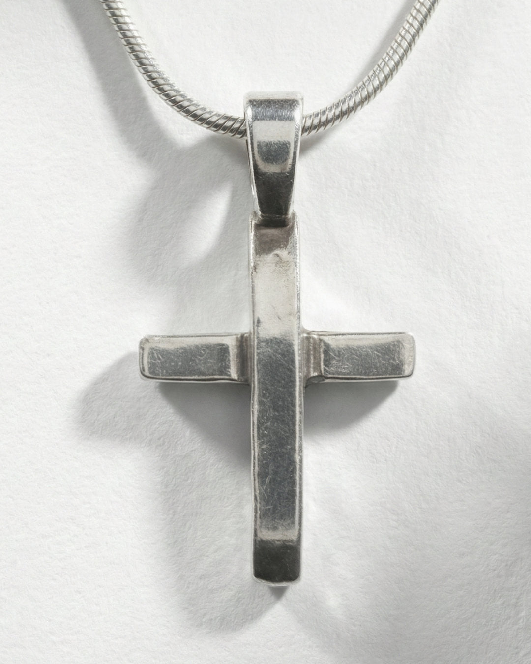 Mark Cross pendant worn, silver with snake chain