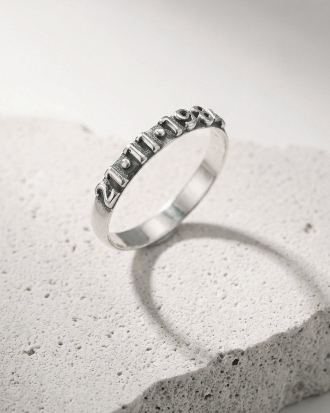 Silver ring with extruded numbers. Custom date ring.