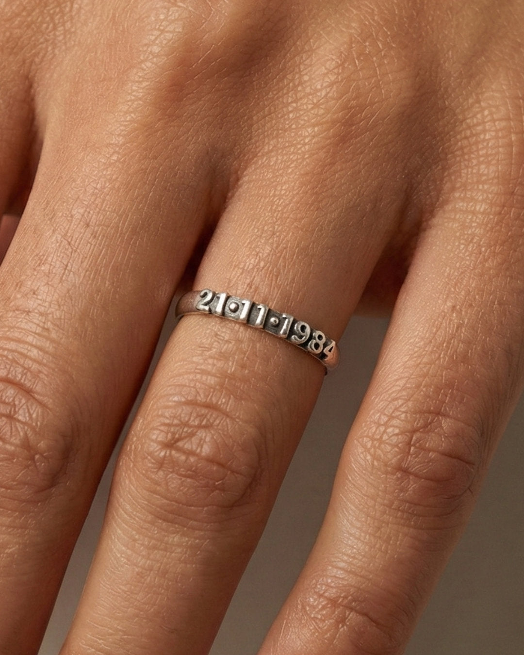 Silver ring with extruded numbers. Custom date ring.