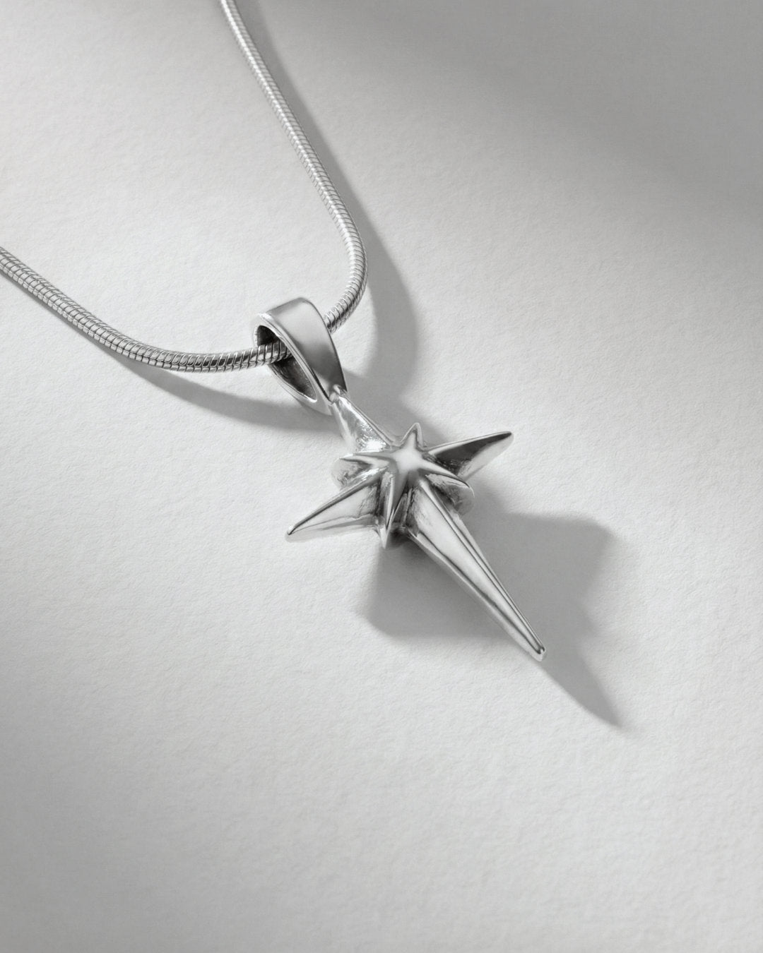 Guspira Cross pendant, close-up solid silver