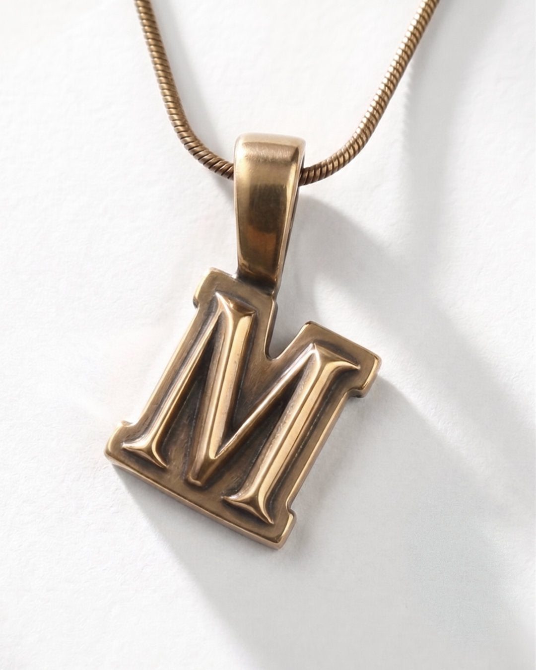 M / PENDENT ®