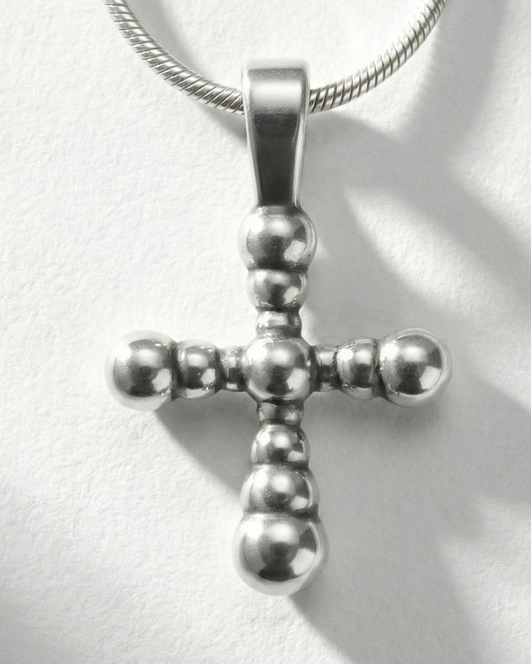 Pearl Cross pendant worn, silver with snake chain